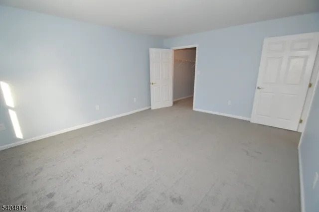 a view of an empty room and entryway