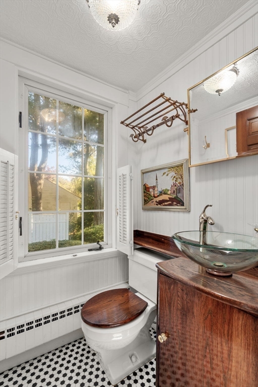 58 Country Club Road Newton, MA 02459 - Photo 12 of 27 a bathroom with a sink a toilet and a shower