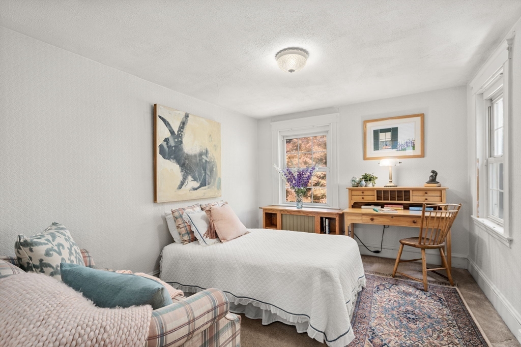 58 Country Club Road Newton, MA 02459 - Photo 16 of 27 a bedroom with a bed and a desk