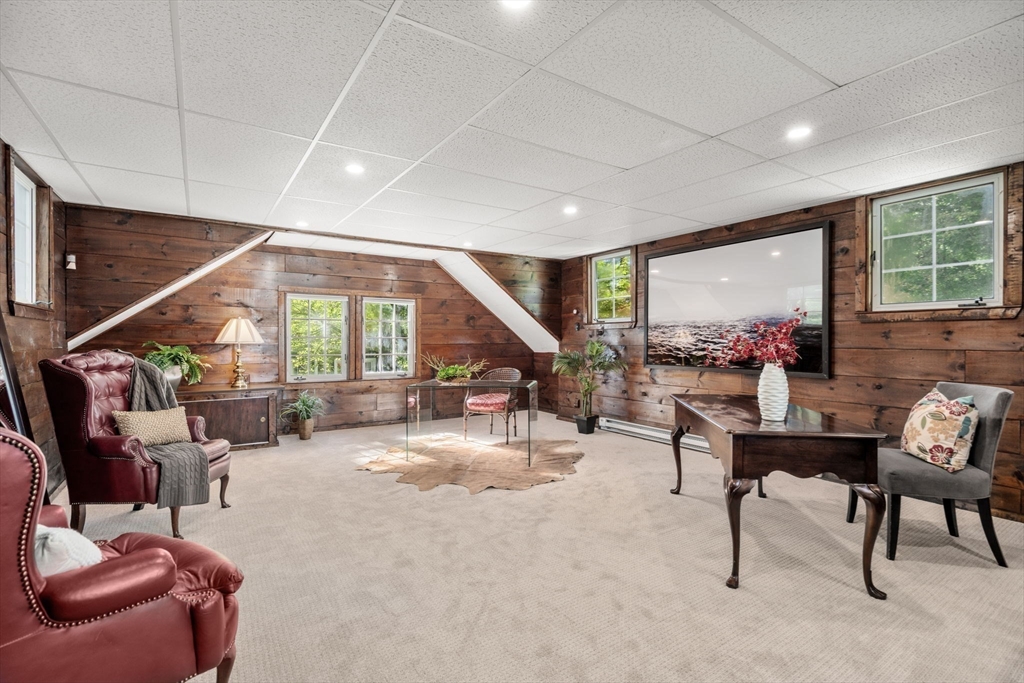 58 Country Club Road Newton, MA 02459 - Photo 20 of 27 a living room with furniture and a potted plant