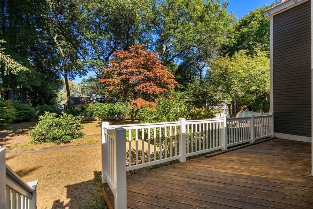 58 Country Club Road Newton, MA 02459 - Photo 21 of 27 a balcony with wooden floor and fence