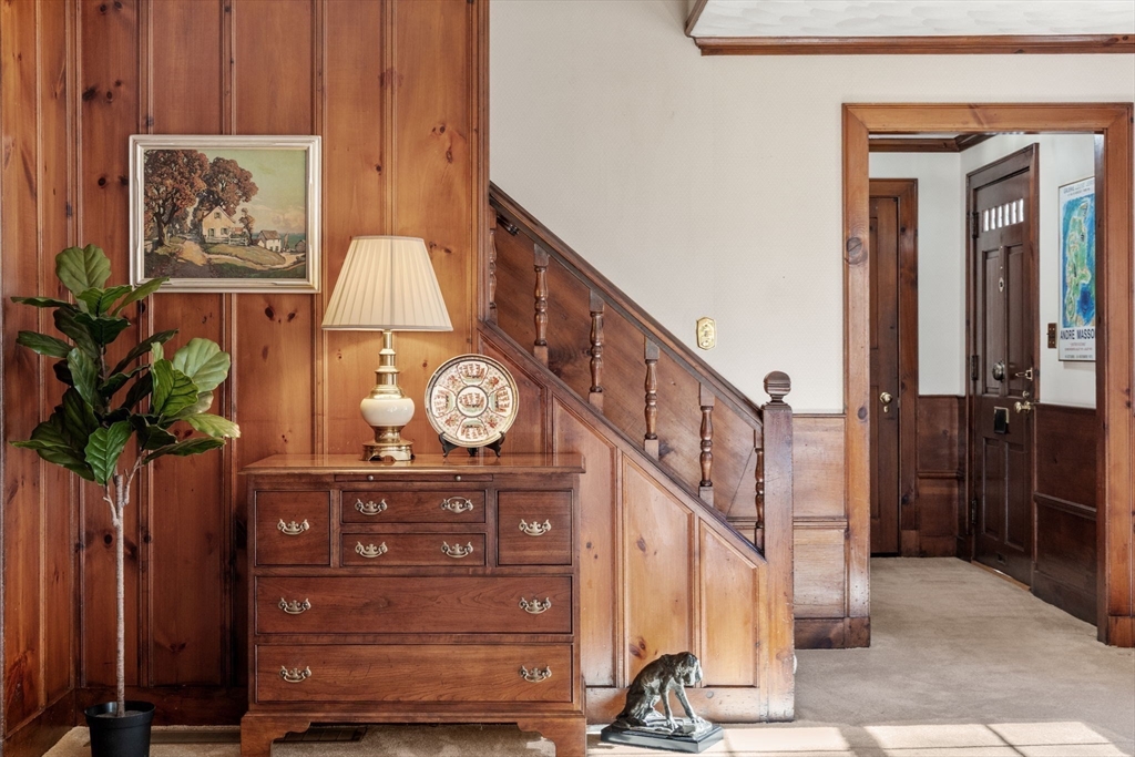 58 Country Club Road Newton, MA 02459 - Photo 3 of 27 a view of a hallway with wooden floor