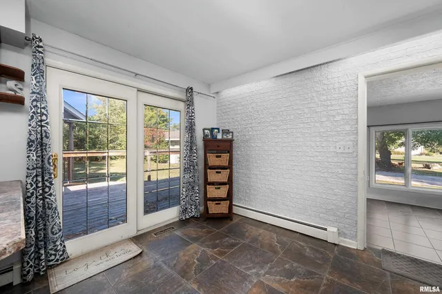 a view of room with window and furniture