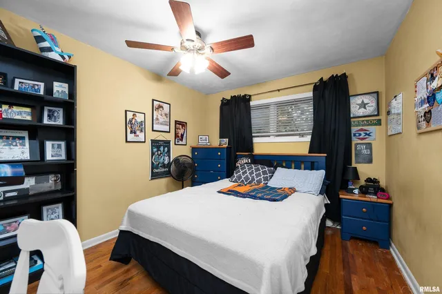 a bedroom with a bed and dresser