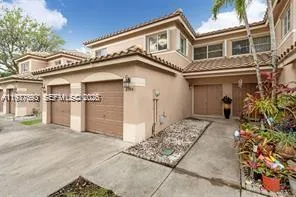 a view of a white building with large windows