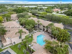 an aerial view of a house with a garden