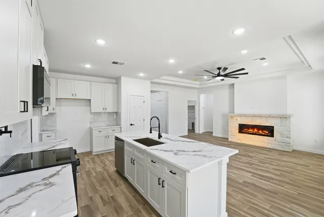 a kitchen with a sink and a refrigerator