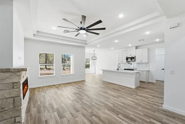 a view of kitchen with cabinets and wooden floor