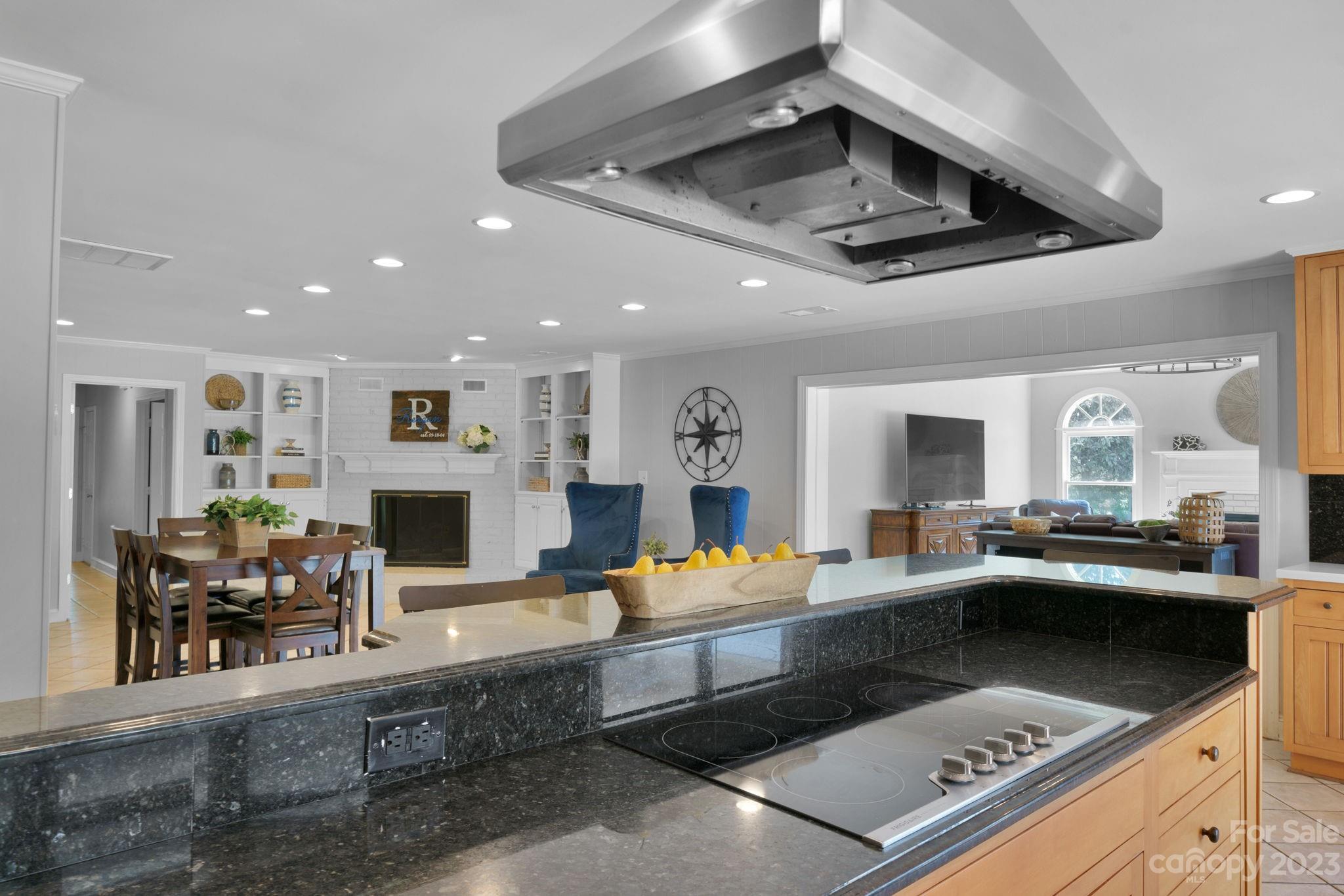 1916 Cox Road Matthews, NC 28104 - Photo 18 of 47 a kitchen with stainless steel appliances kitchen island granite countertop a sink and cabinets