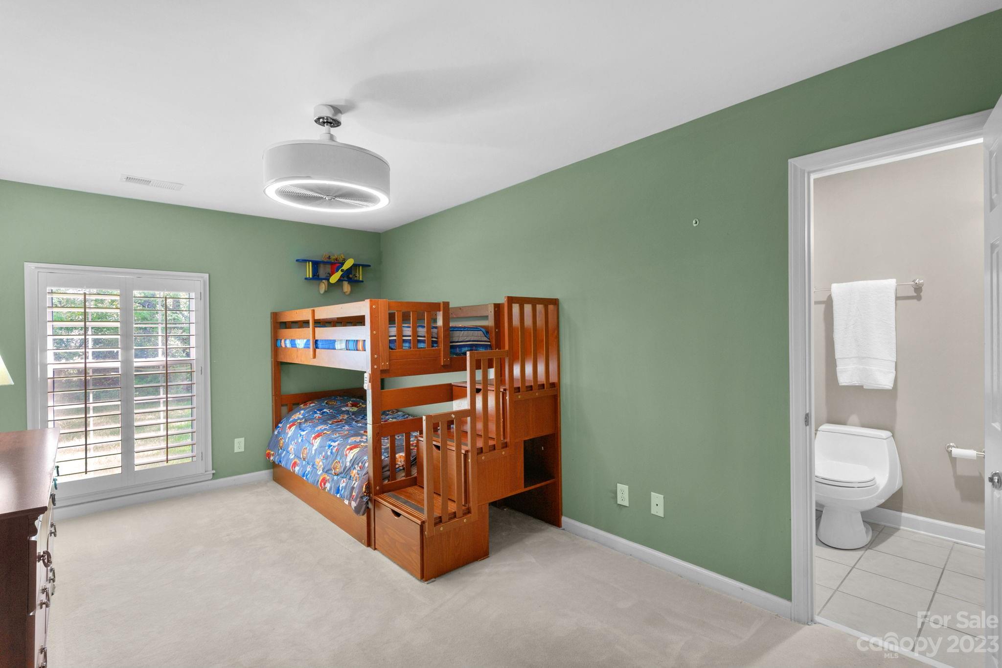 1916 Cox Road Matthews, NC 28104 - Photo 27 of 47 a bedroom with a bed and a large window