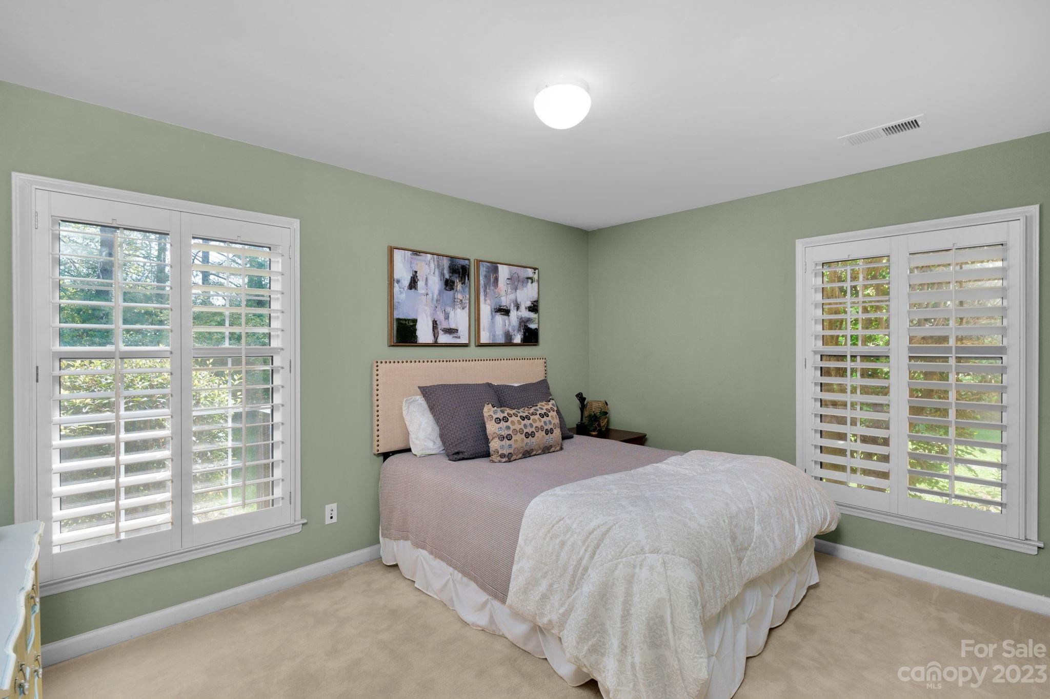 1916 Cox Road Matthews, NC 28104 - Photo 28 of 47 a bedroom with a large bed and a window