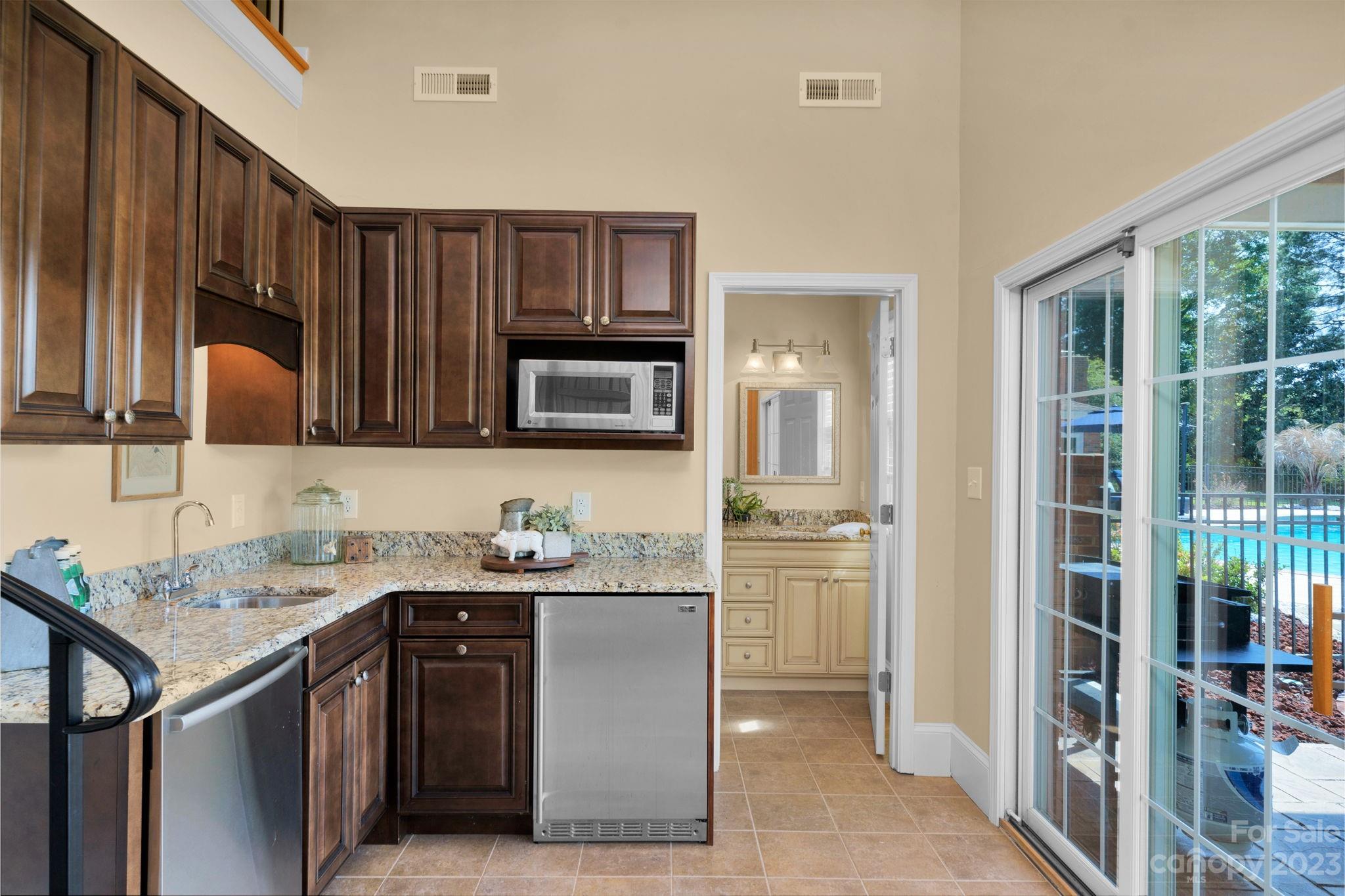 1916 Cox Road Matthews, NC 28104 - Photo 32 of 47 a kitchen with stainless steel appliances granite countertop a sink stove and cabinets