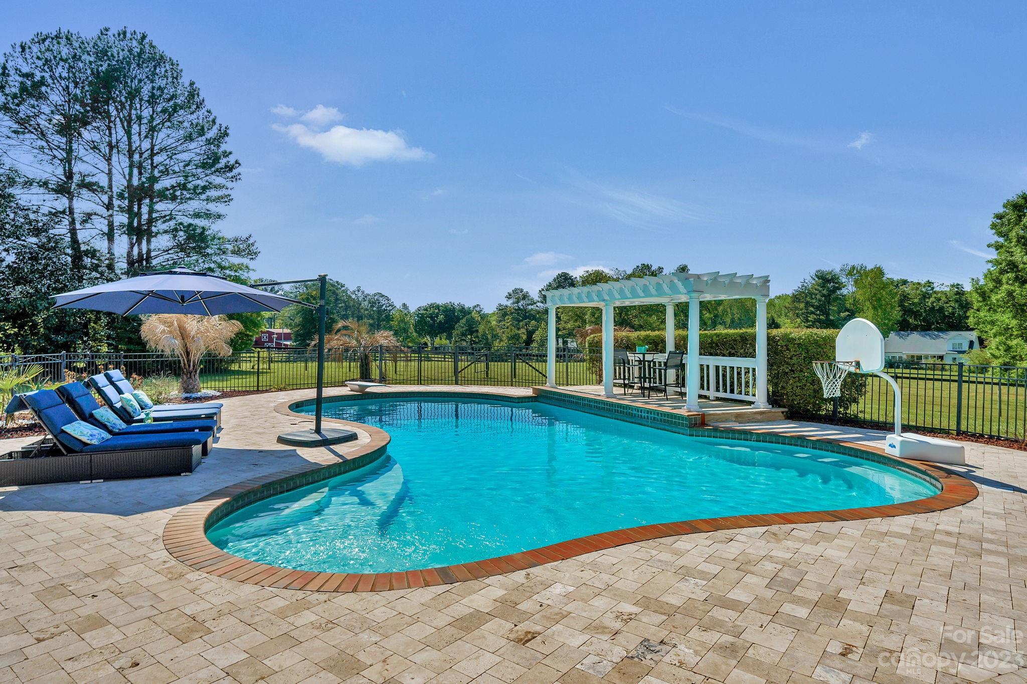 1916 Cox Road Matthews, NC 28104 - Photo 39 of 47 a view of a swimming pool with a patio