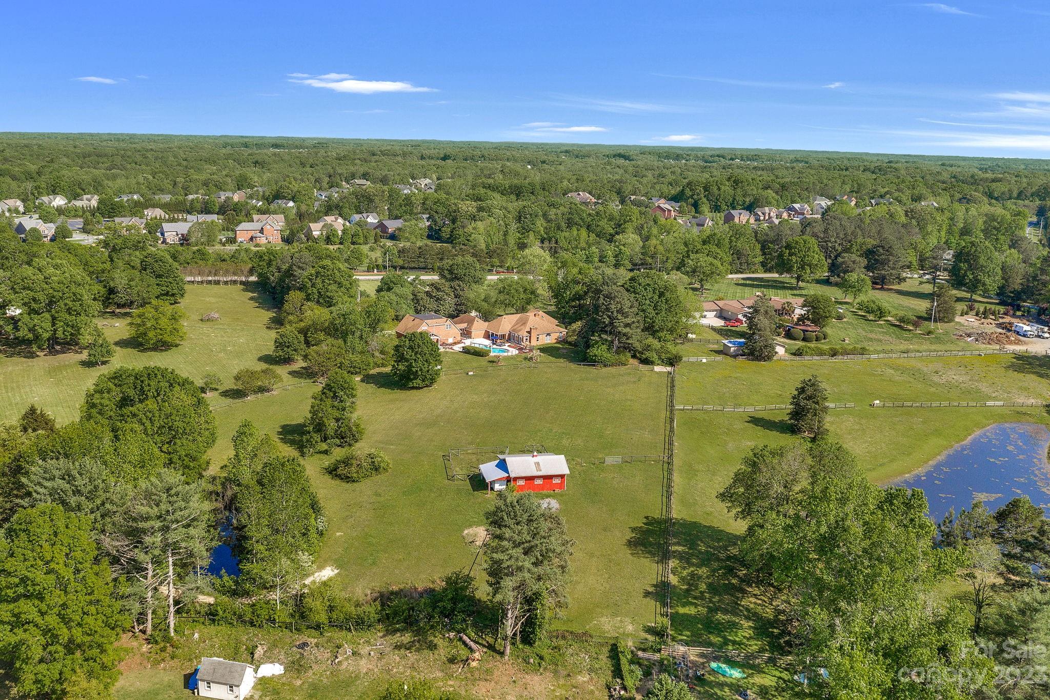 1916 Cox Road Matthews, NC 28104 - Photo 43 of 47 a view of a lake with a house