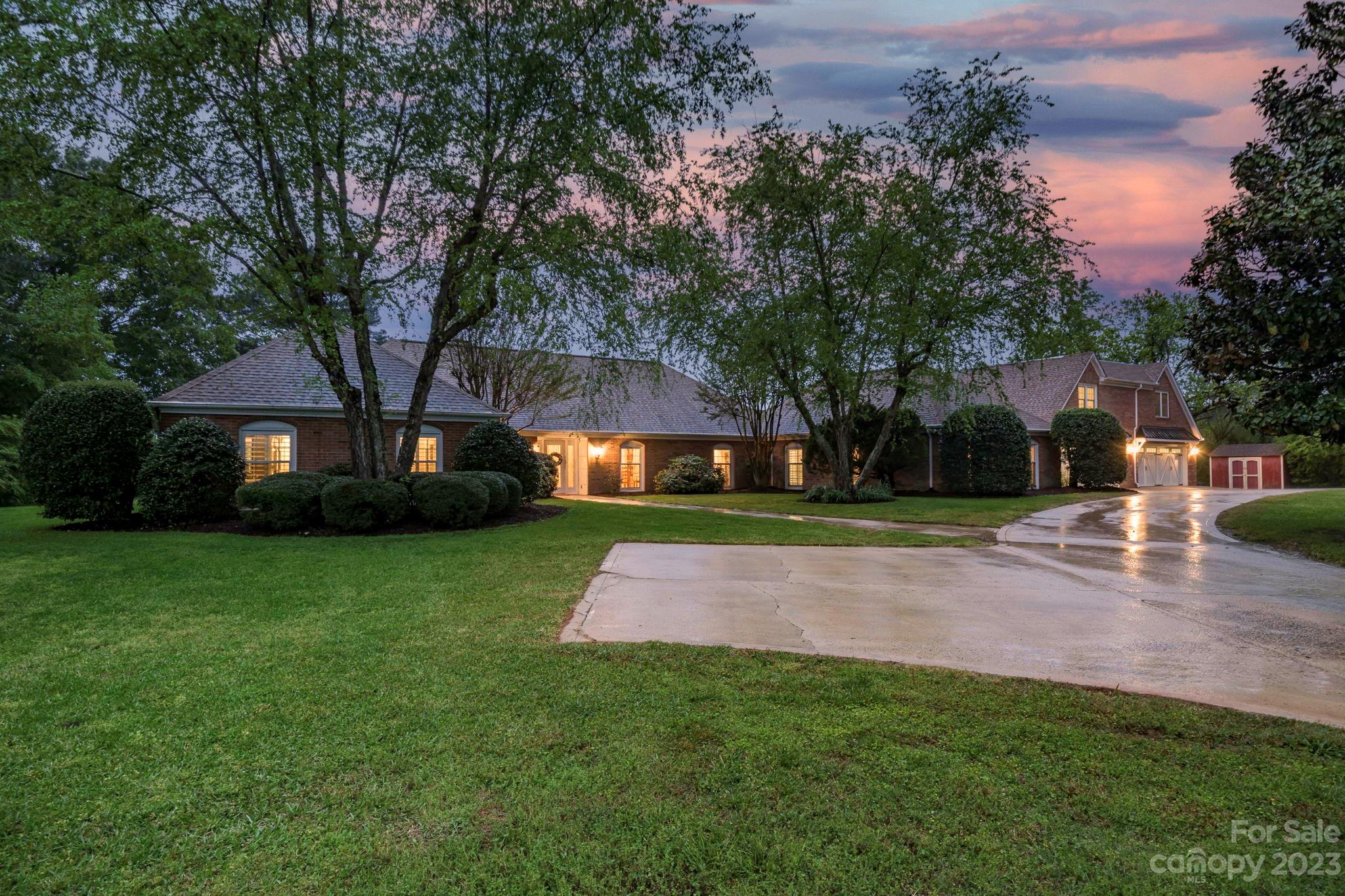 1916 Cox Road Matthews, NC 28104 - Photo 44 of 47 a view of a yard with plants and trees