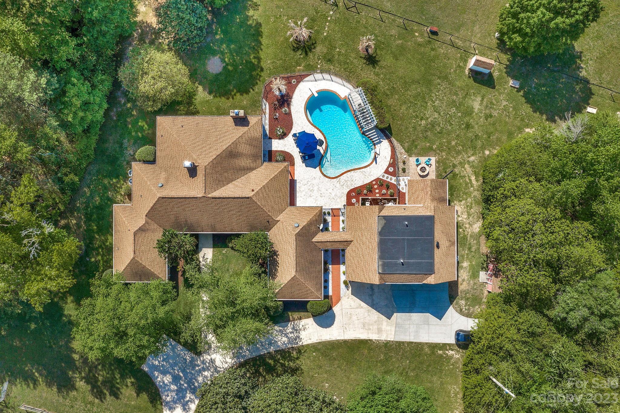 1916 Cox Road Matthews, NC 28104 - Photo 6 of 47 an aerial view of house with yard swimming pool and outdoor seating