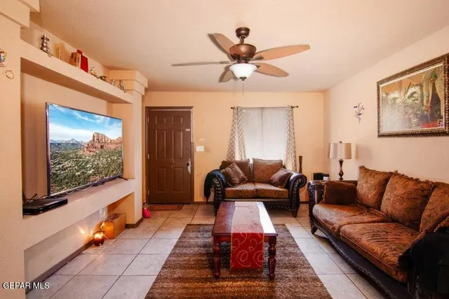a living room with furniture and a flat screen tv