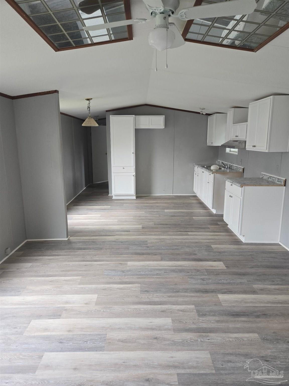 5675 Saufley Field Road, Unit 9 Pensacola, FL 32526 - Photo 11 of 15 a view of a hallway with a kitchen