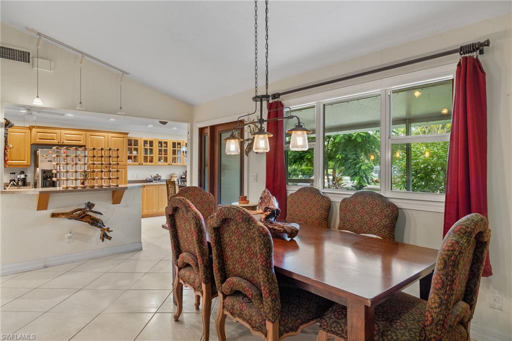 5730 Cedar Tree Lane Naples, FL 34116 - Photo 13 of 22 a view of a dining room with furniture window and outside view