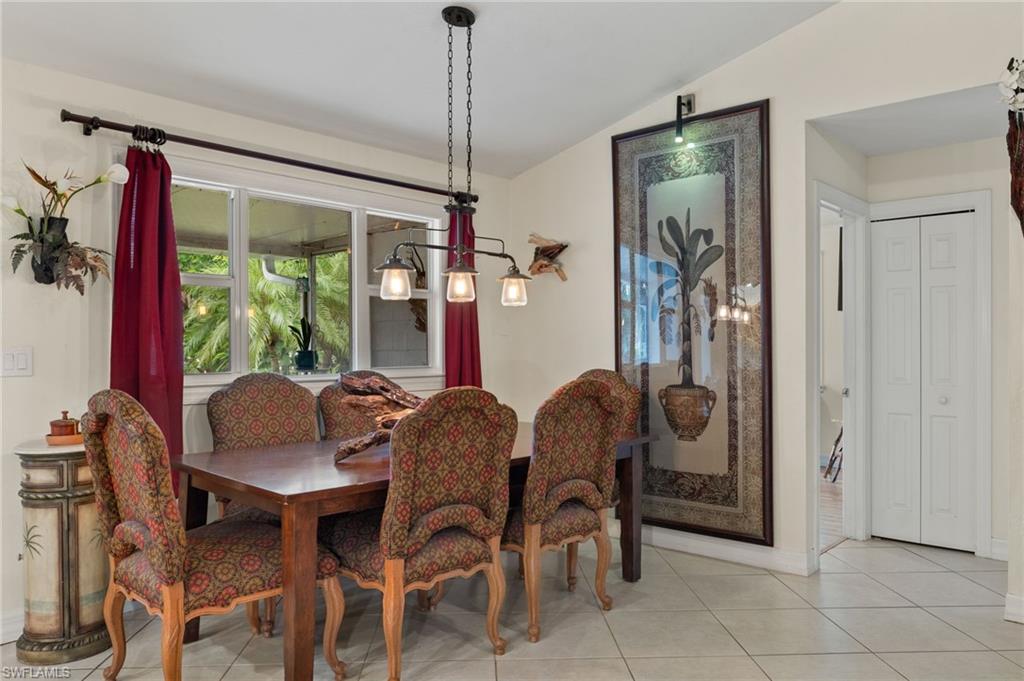 5730 Cedar Tree Lane Naples, FL 34116 - Photo 14 of 22 a dining room with furniture and window