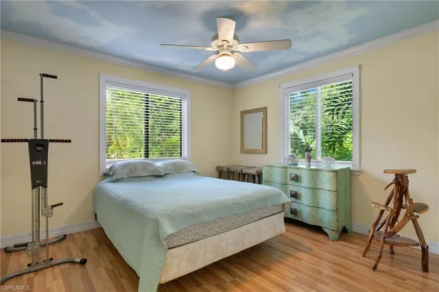 a bedroom with a bed and a table