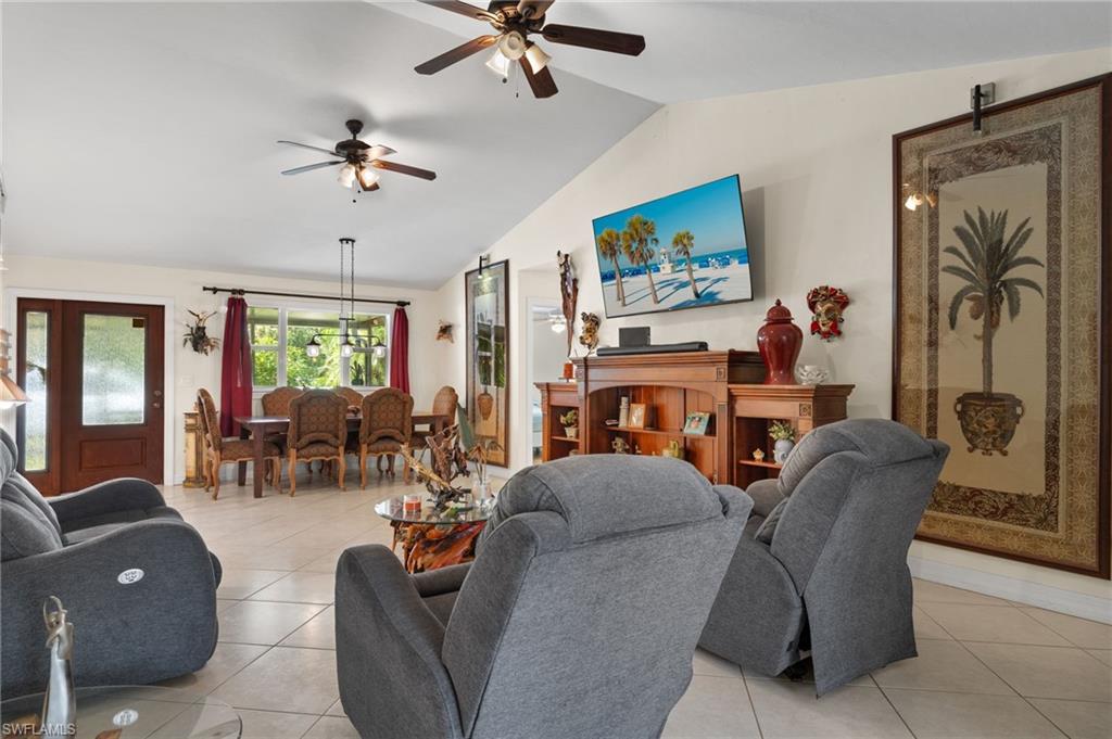 5730 Cedar Tree Lane Naples, FL 34116 - Photo 5 of 22 a living room with furniture and wooden floor
