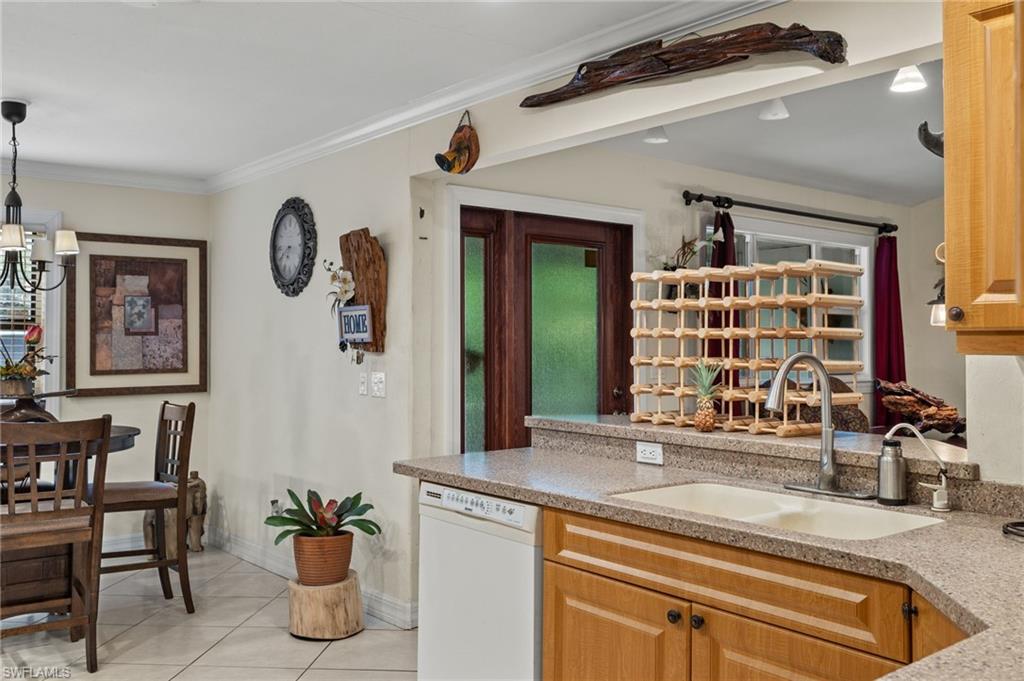 5730 Cedar Tree Lane Naples, FL 34116 - Photo 10 of 22 a view of a living room and entryway