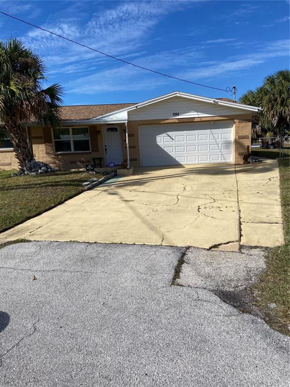5343 Bluepoint Drive Port Richey, FL 34668 - Photo 12 of 28 a view of a house with a yard