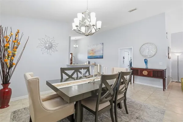 a spacious bedroom with a bed and a table