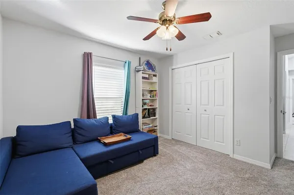 a living room with furniture and a window