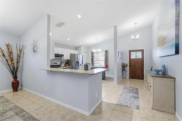 a kitchen with stainless steel appliances a sink and cabinets