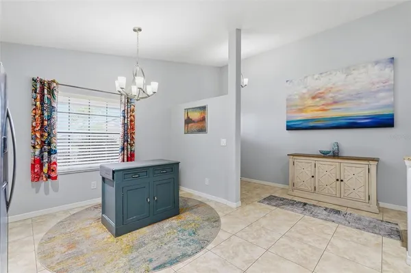 a living room with kitchen island furniture and a fireplace