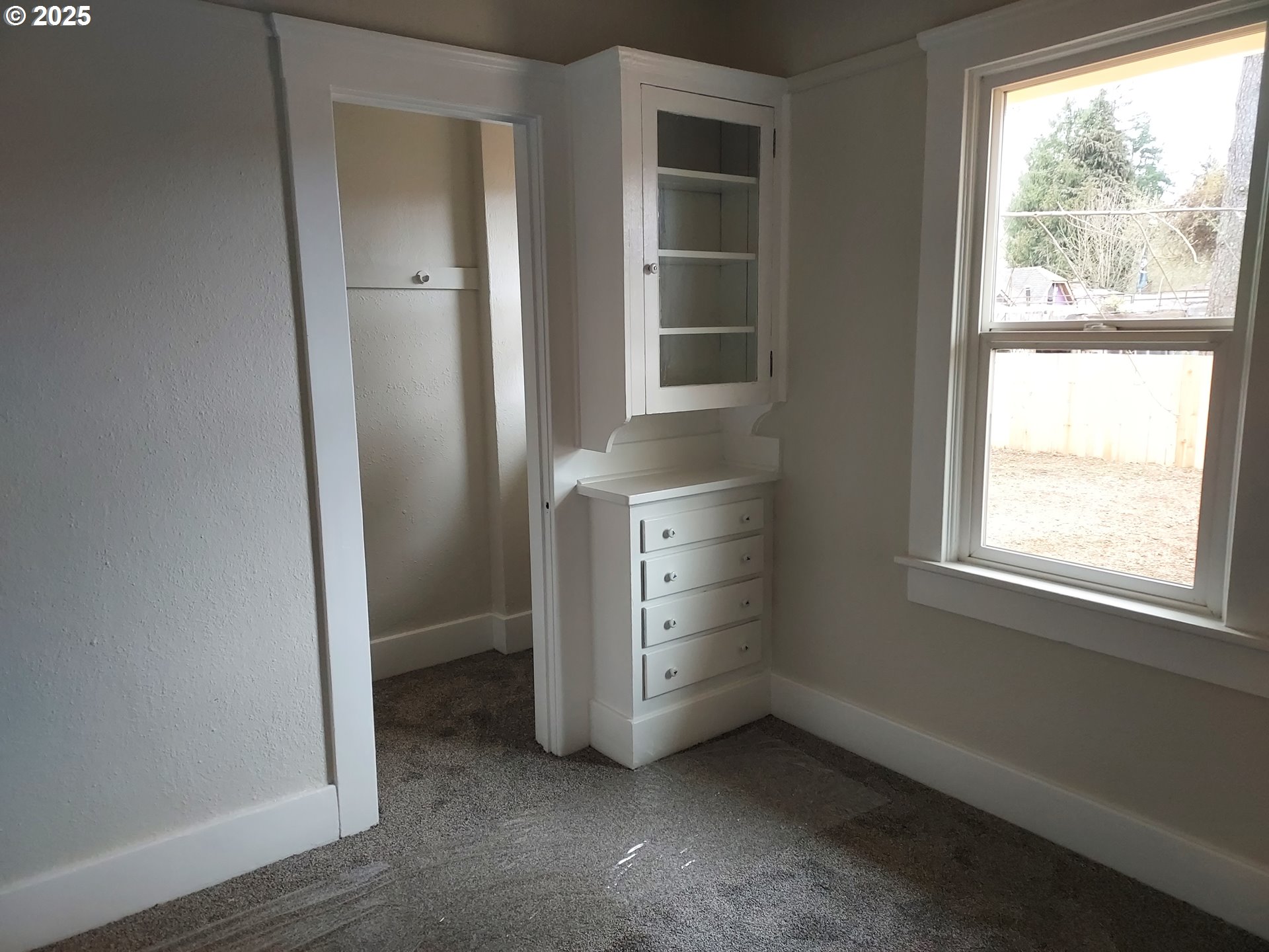 405 1/2 River Road Eugene, OR 97404 - Photo 11 of 18 an empty room with windows and cabinet