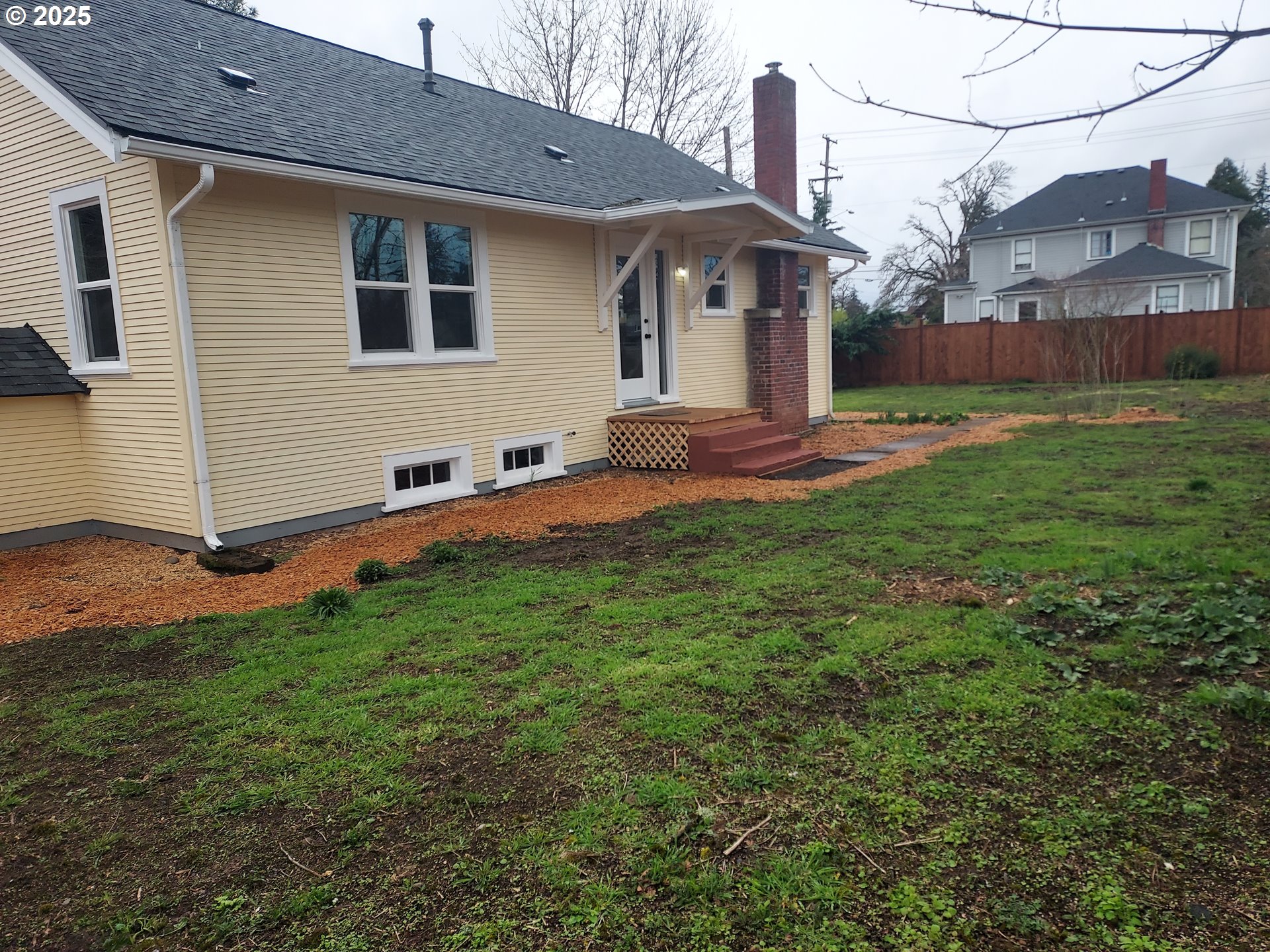 405 1/2 River Road Eugene, OR 97404 - Photo 15 of 18 a view of a house with a yard