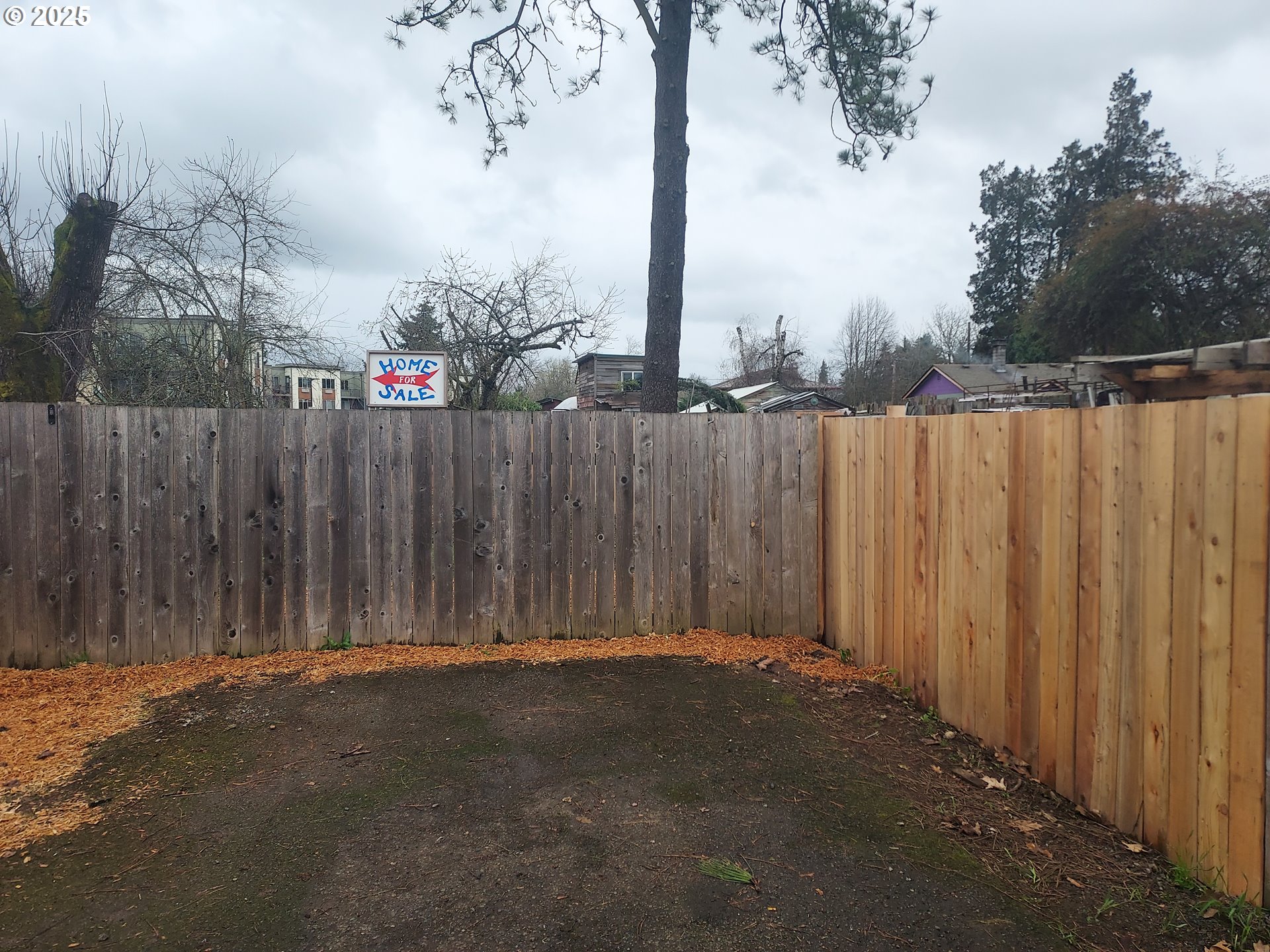 405 1/2 River Road Eugene, OR 97404 - Photo 16 of 18 a view of outdoor space with wooden fence