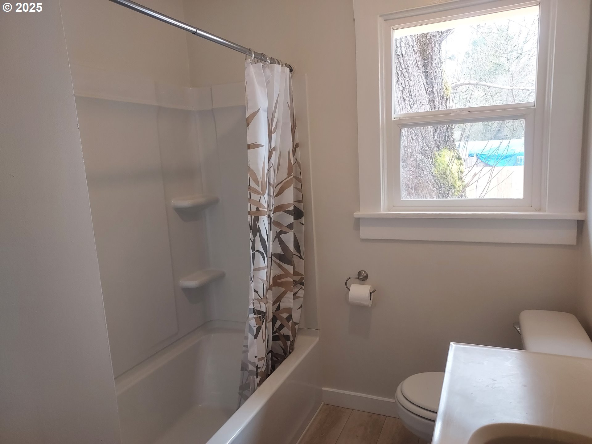 405 1/2 River Road Eugene, OR 97404 - Photo 17 of 18 a bathroom with a shower and a toilet