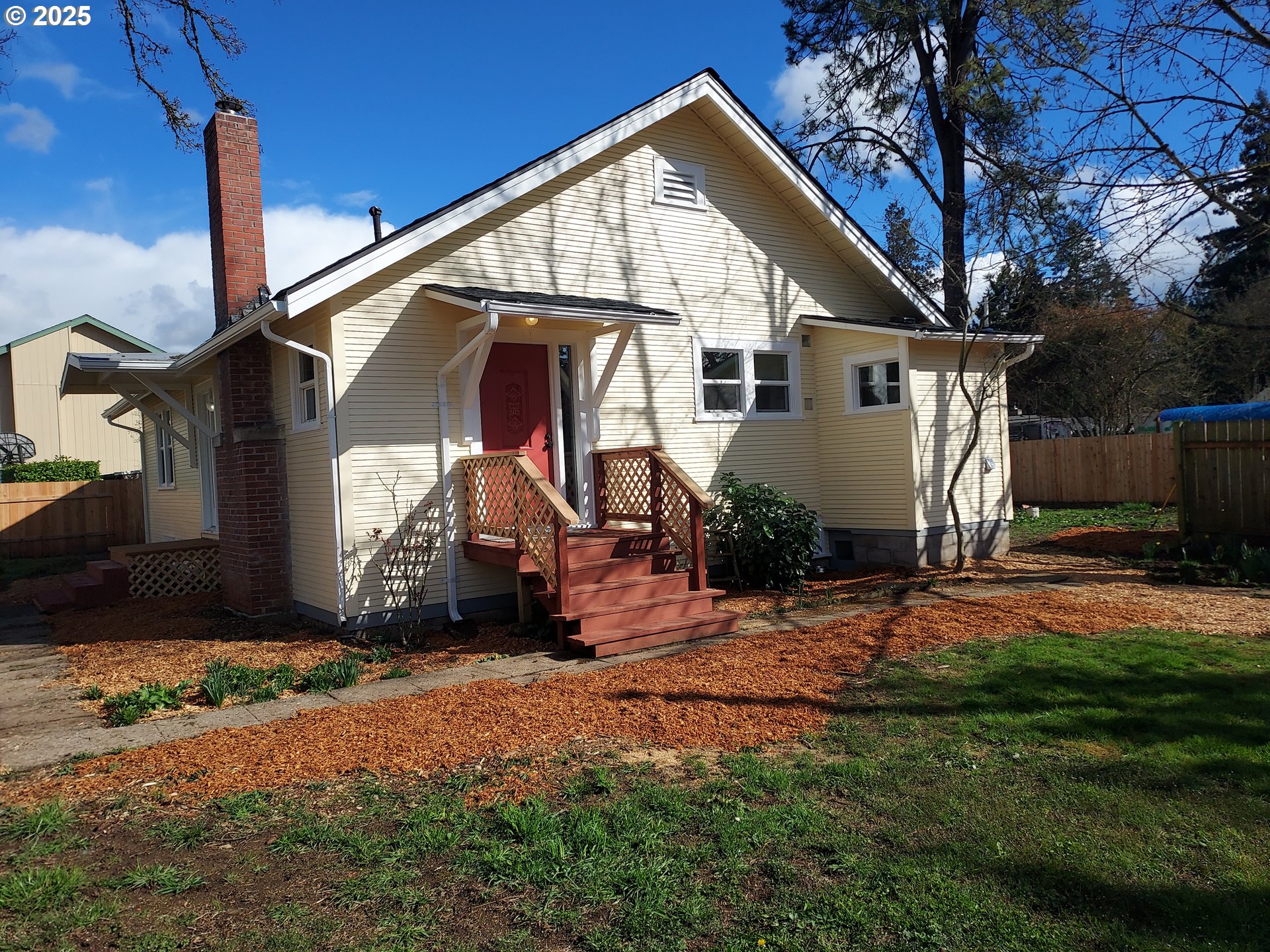 405 1/2 River Road Eugene, OR 97404 - Photo 2 of 18 a view of a house with a yard