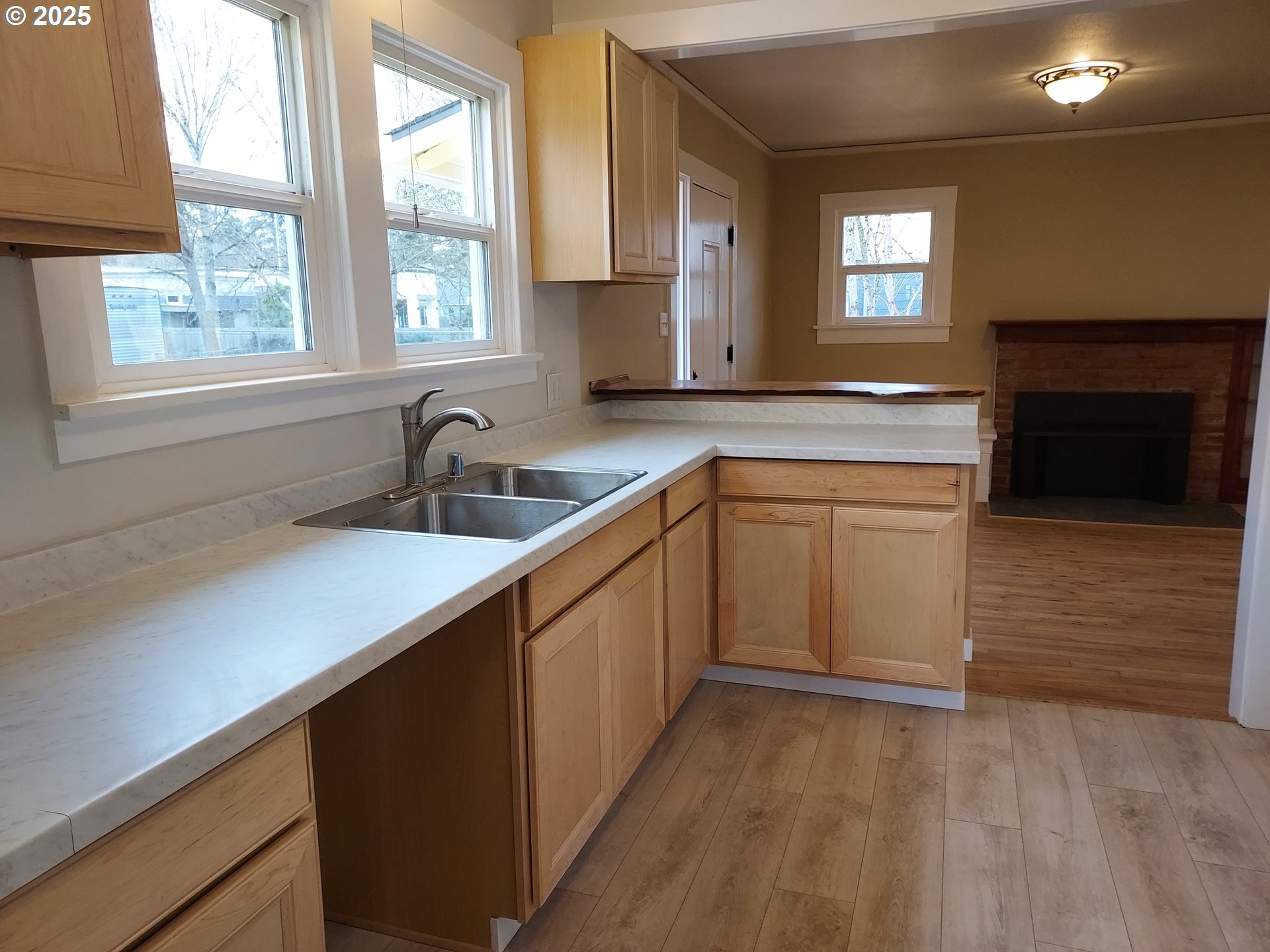 405 1/2 River Road Eugene, OR 97404 - Photo 5 of 18 a kitchen with a sink window and cabinets