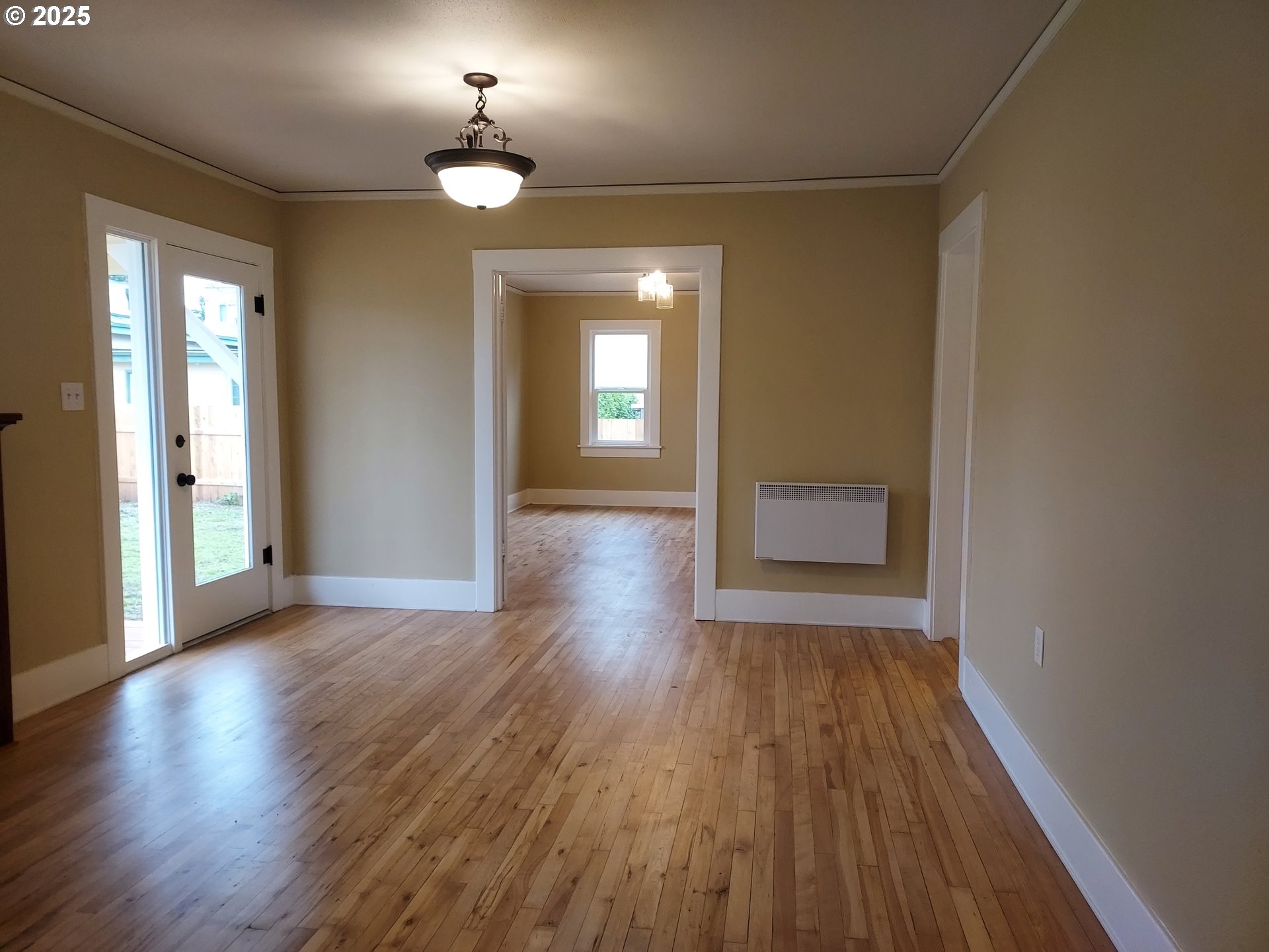 405 1/2 River Road Eugene, OR 97404 - Photo 7 of 18 wooden floor in an empty room with a window