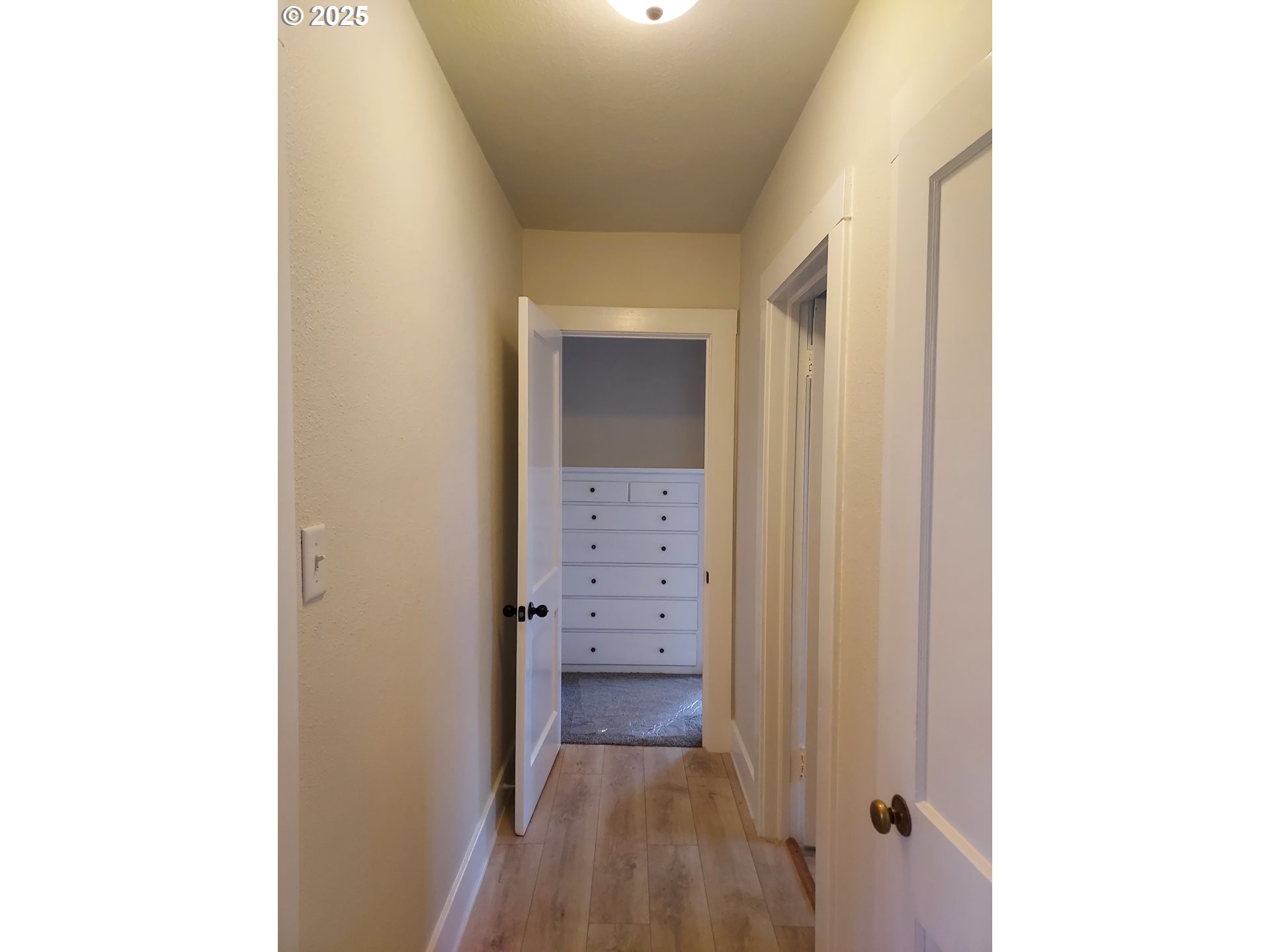 405 1/2 River Road Eugene, OR 97404 - Photo 8 of 18 a view of a hallway with wooden floor