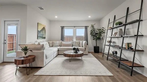 a living room with furniture and a window