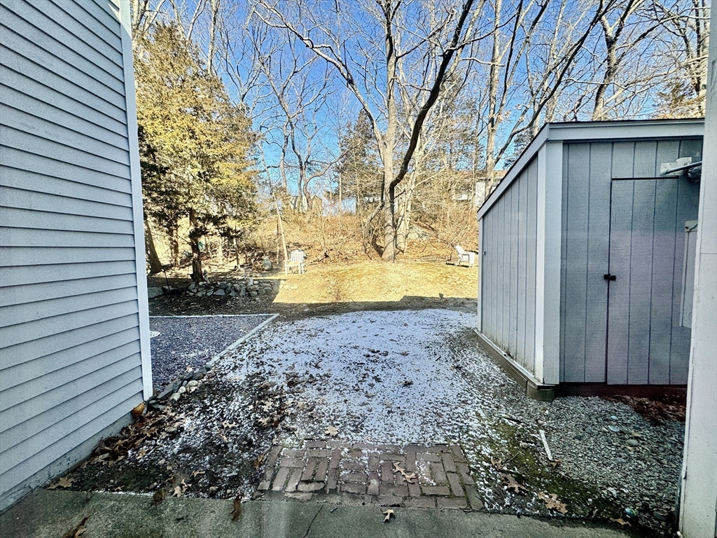 13 Beal's Cove Road, Unit E Hingham, MA 02043 - Photo 19 of 20 a view of a back yard of the house