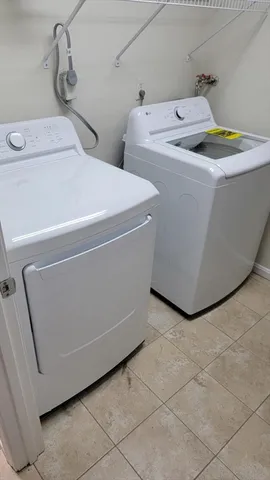 a utility room with dryer and washer