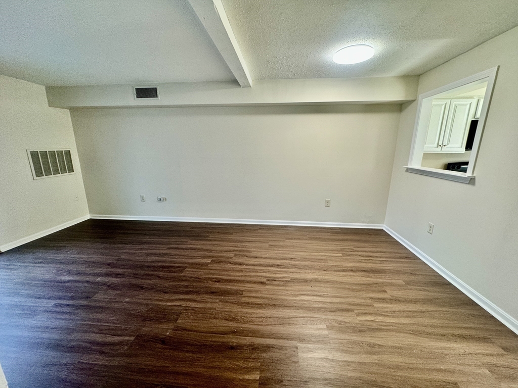 13 Beal's Cove Road, Unit E Hingham, MA 02043 - Photo 6 of 20 wooden floor in an empty room