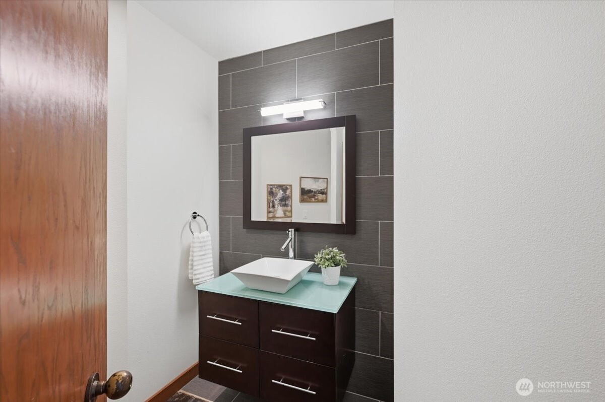 9418 Odin Way Bothell, WA 98011 - Photo 16 of 39 a bathroom with a sink and a mirror