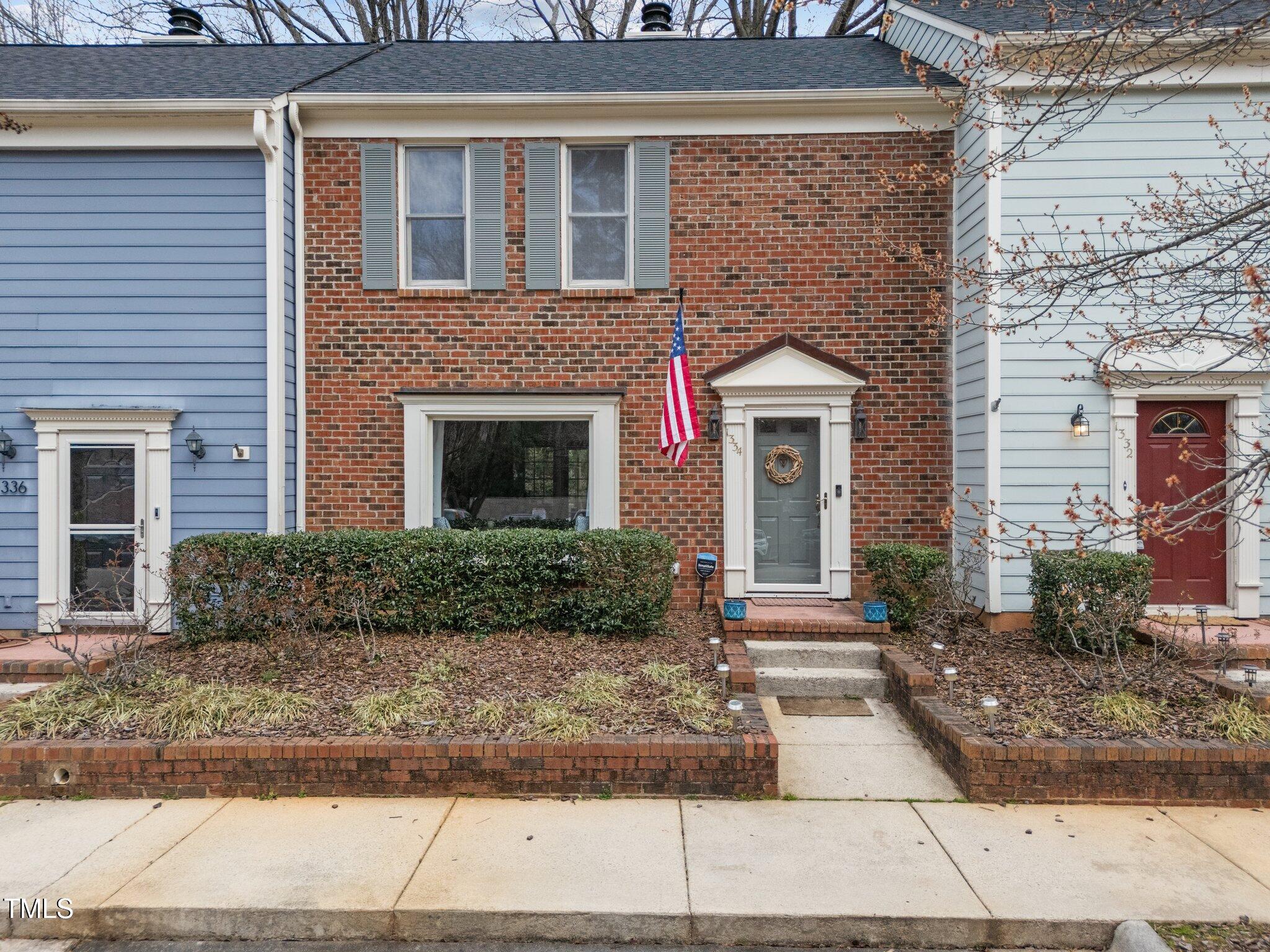1334 Baez Street Raleigh, NC 27608 - Photo 1 of 28 a front view of a house with yard