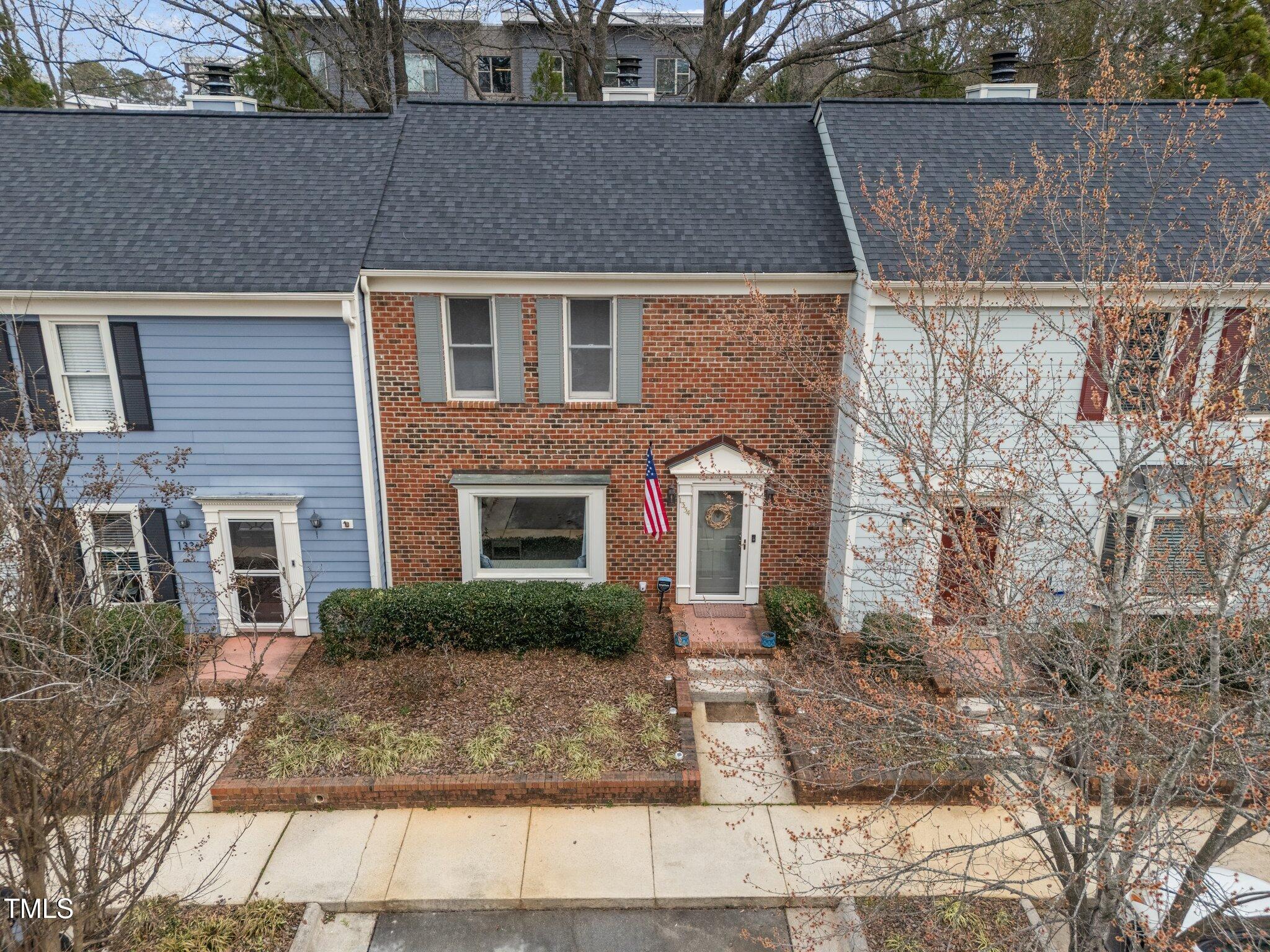 1334 Baez Street Raleigh, NC 27608 - Photo 26 of 28 a front view of a house with garden