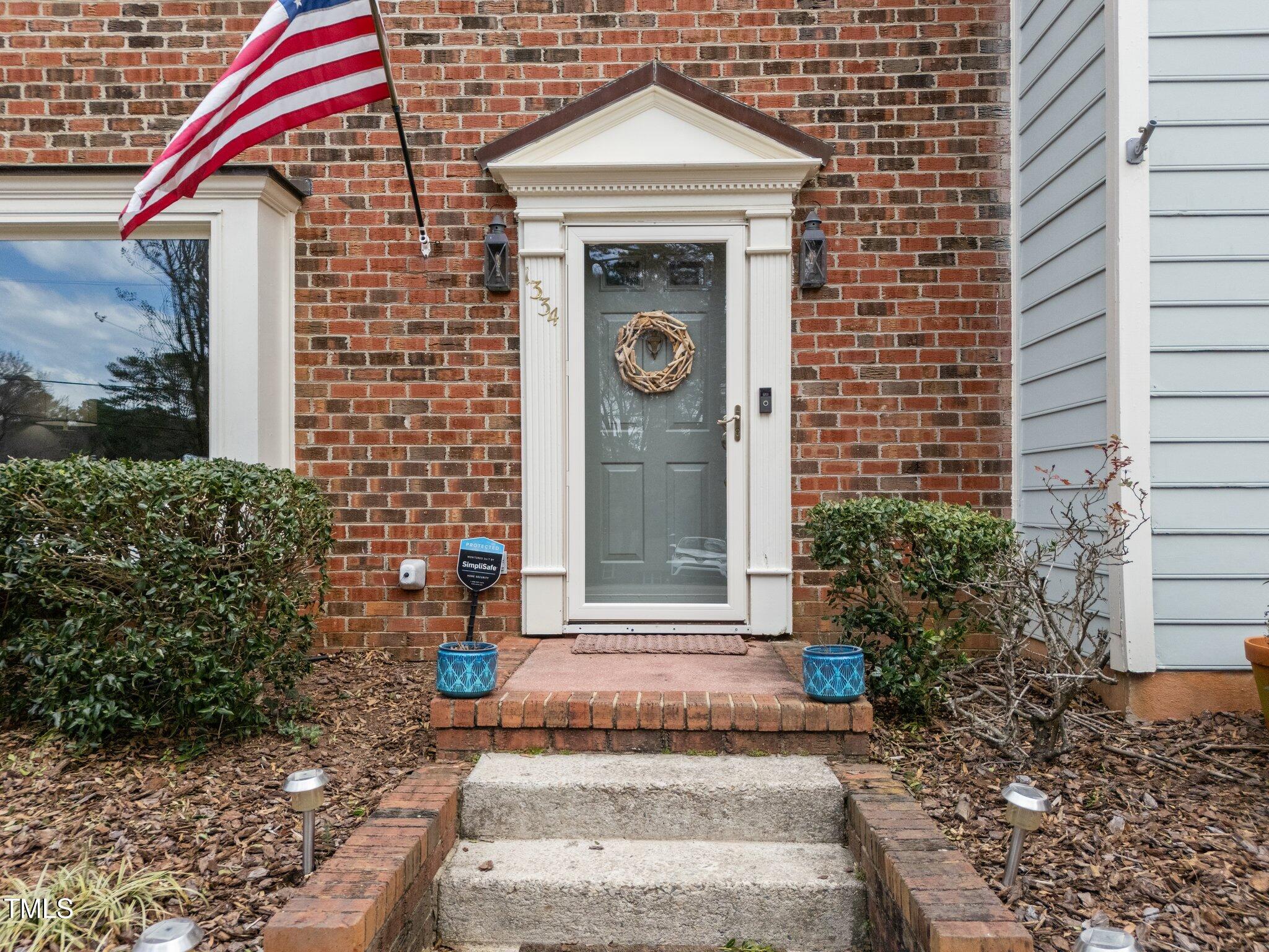 1334 Baez Street Raleigh, NC 27608 - Photo 2 of 28 a front view of a house with a yard