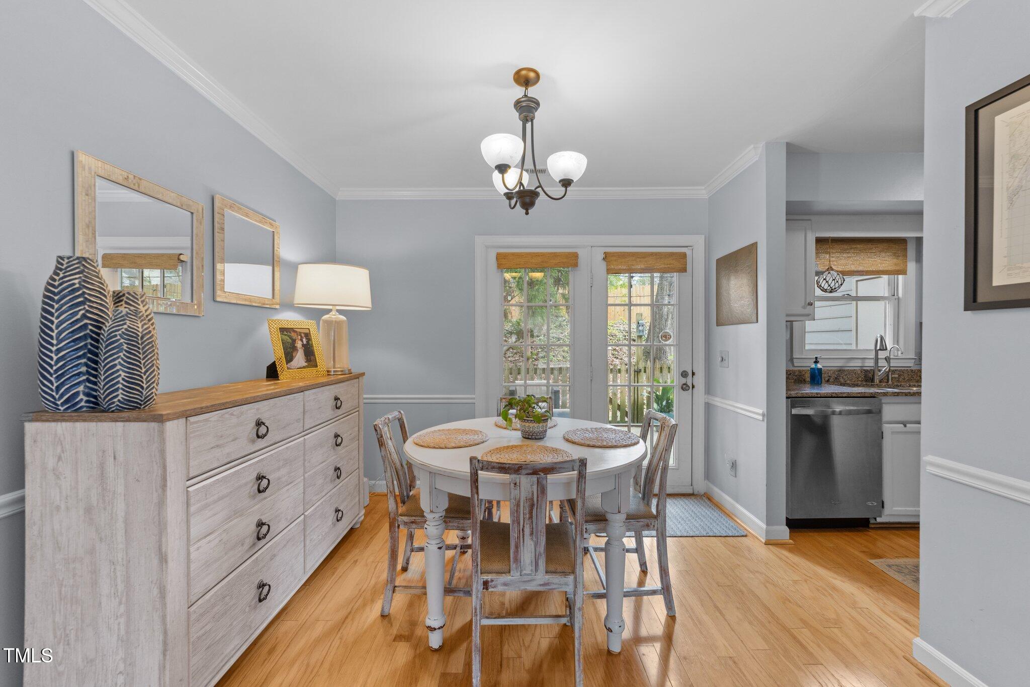 1334 Baez Street Raleigh, NC 27608 - Photo 6 of 28 a view of a dining room with furniture window and wooden floor