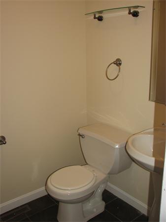 579 Old Warren Road Palmer, MA 01069 - Photo 8 of 27 a white toilet sitting next to a shower